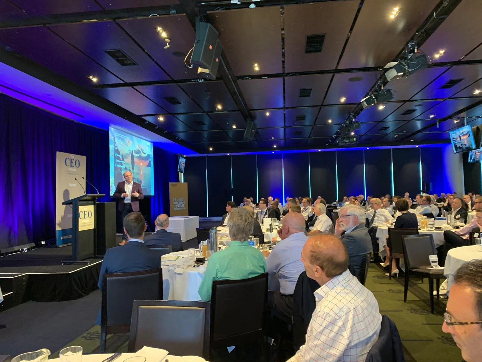 Morris Misel, top keynote speaker in Australia, presenting on stage.